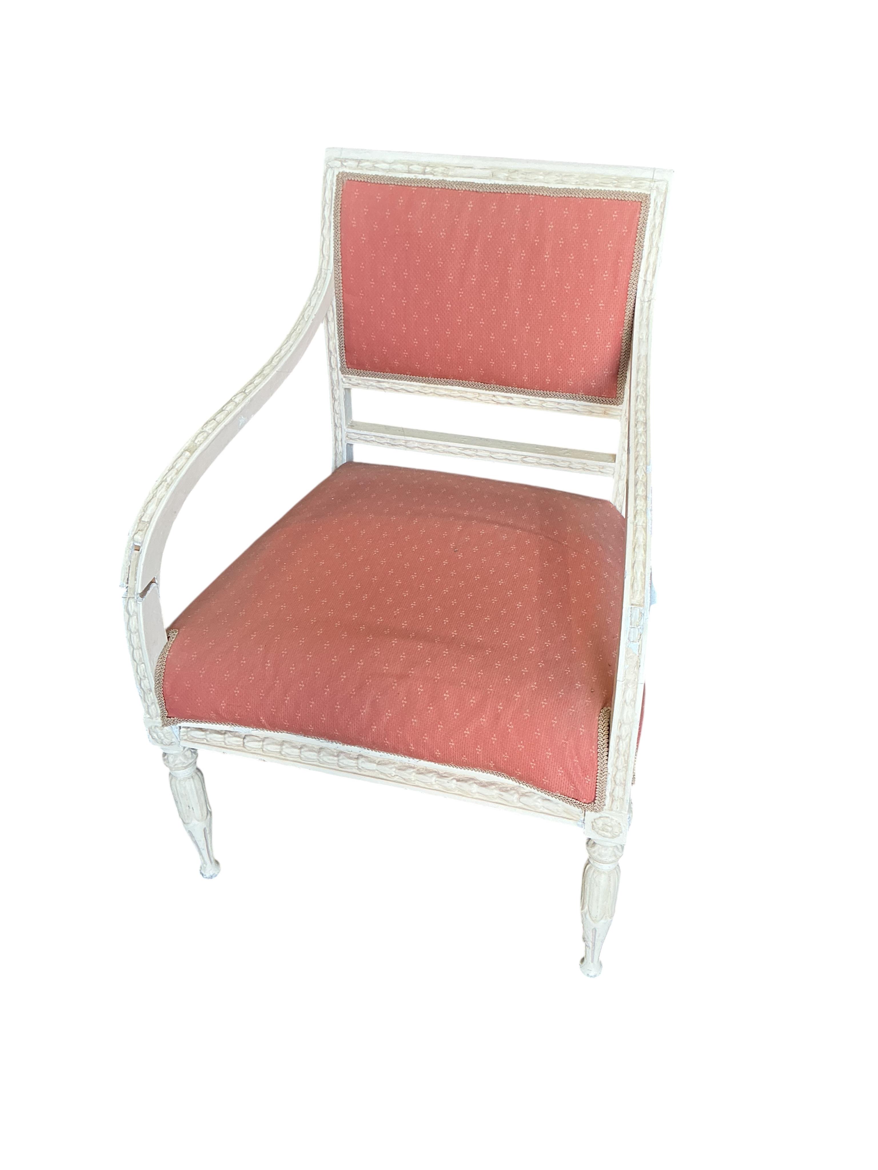 A harlequin set of six 20th century Louis XVI style white painted chairs with red upholstery